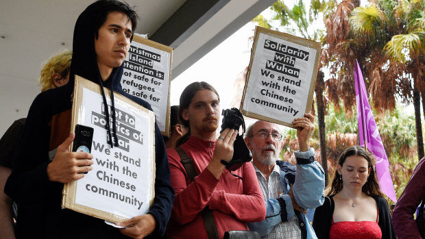 Protesters rally against an inbound travel ban on foreign travellers from China in Sydney last week.