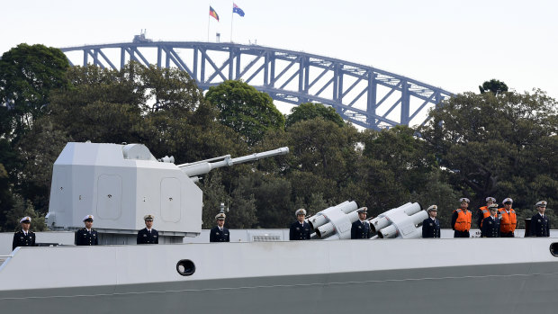 Chinese Navy personnel are seen on board a Chinese warship that arrived at Garden Island Naval Base in Sydney on Monday.