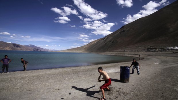 Children play cricket by Pangong Lake, near the India-China border in Ladakh, India, in this 2011 file photo. 