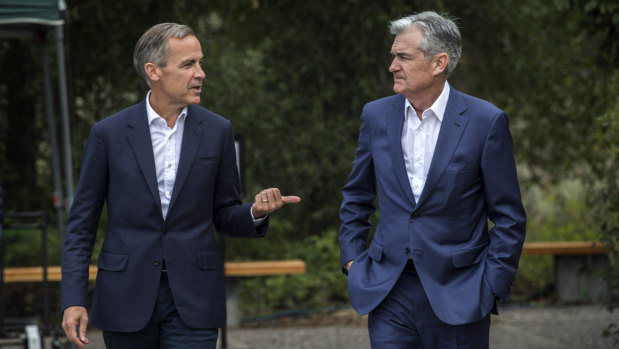 Bank of England Governor Mark Carney, left, chatting with Fed chairman Jerome Powell at the Jackson Hole Economic Policy Symposium.