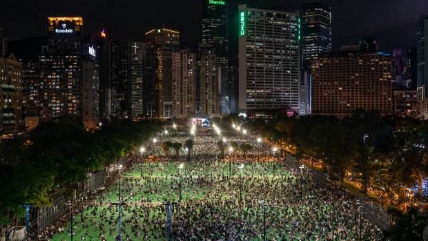 Thousands of participants take part in a memorial vigil in Victoria Park in Hong Kong, China. 