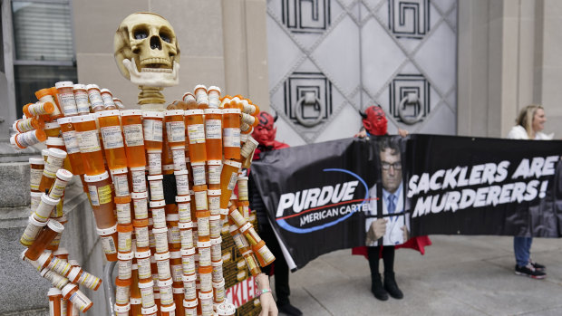 “Pill Man”, made by a victim from his opioid prescription pill bottles, outside the US Department of Justice in December.