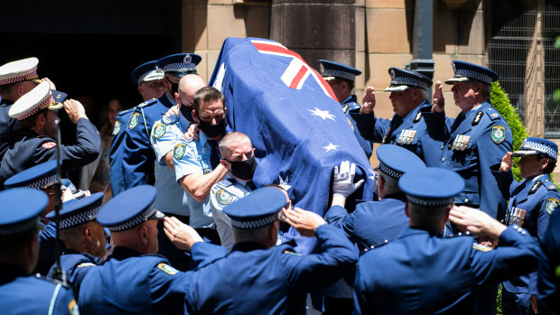  Members of the NSW Police stand in a guard of honour as the casket of Senior Constable Kelly Foster.
