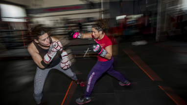 Take that: Pro boxer Bianca Elmir (right) spars with aspiring boxer Gemma Rafferty, at a clinic at Mischa's Boxing Central gym in Footscray.