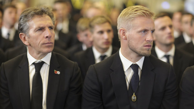 Farewell: Leicester keeper Peter Schmeichel (right), alongside manager Claude Puel at Vichai's funeral in Thailand.