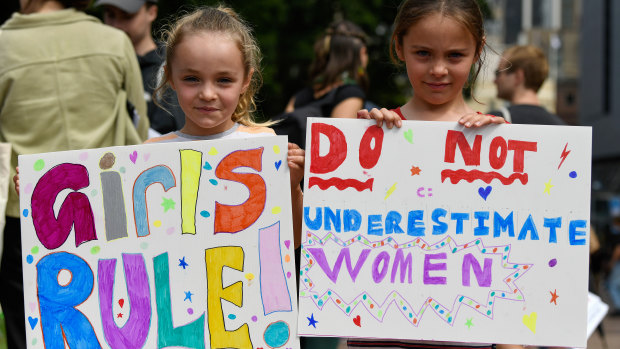 Sisters Doris, 6, and Scarlett Gilmore, 8, at the International Women's Day rally in Hyde Park.