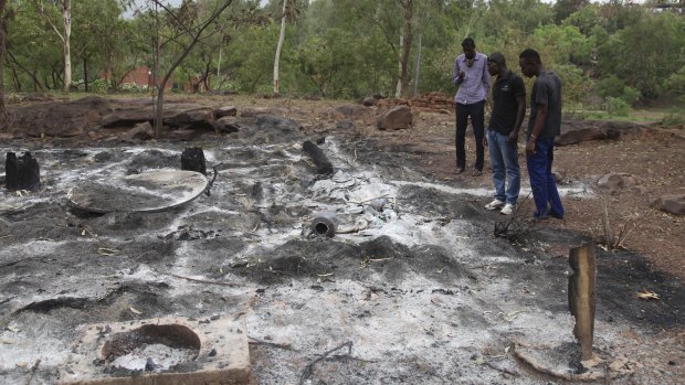 Attacks by extremists are not uncommon in Mali. In this picture from June 2017, locals survey the burned Campement Kangaba after an Islamic extremist attack near Bamako. 