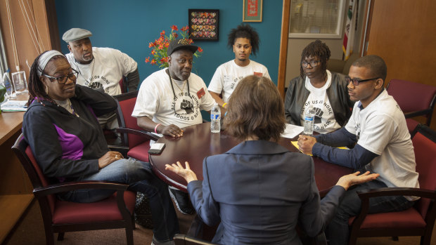 Members of the 'All of Us or None' lobby group meet a state senator in California last year. Some US states deny citizens who have served time in jail for felonies the vote. But few go as far as sentencing convicted criminals to "civil death".