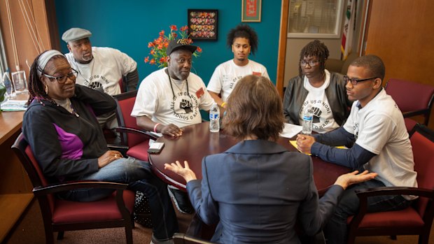 Members of the 'All of Us or None' lobby group meet a state senator in California last year. Some US states deny citizens who have served time in jail for felonies the vote. But few go as far as sentencing convicted criminals to "civil death".