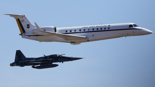 A Brazilian Air Force plane is escorted by a fighter jet as it carries the heart of Brazil’s former emperor Dom Pedro I and prepares to land at an air base in Brasilia.