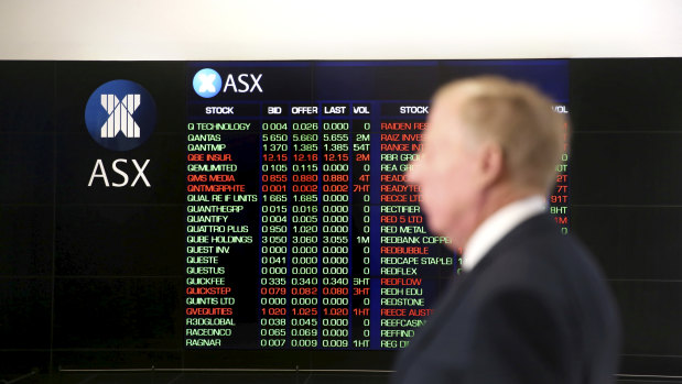 ASX stock figures light up on electronic displays at the ASX foyer in the Sydney CBD.