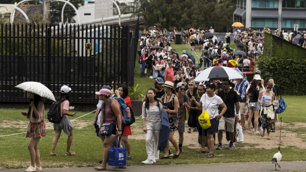People line up to enter Mrs Macquarie's Chair in preparation for New Year's Eve in Sydney on Monday.