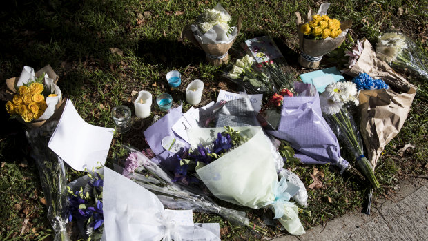 Flowers and candles outside the house where Jack and Jennifer Edwards were murdered by their father, John Edwards in 2018.