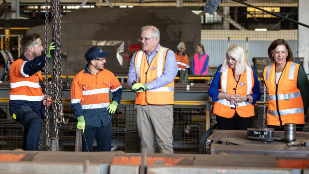 Prime Minister Scott Morrison speaks to Trent Davis (left) and Khan Donovan (centre) with Federal Minister for Industry, Science and Technology Karen Andrews and Qld Opposition Leader Deb Frecklington on a visit to Neumann Steel Fabrication on the Gold Coast.