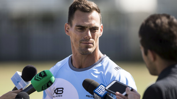 Hopeful: John Morris, speaking to the media during a Sharks training session at Cronulla, is keen to secure a long-term deal for his first head coaching role. 