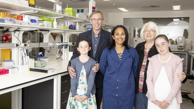 Cancer researcher Professor Sudha Rao (centre) at the Melanie Swan Memorial Translational Centre with Melanie's parents David and Carol Swan, and daughters Sophie (8) and Emma (11) Chamberlain.
