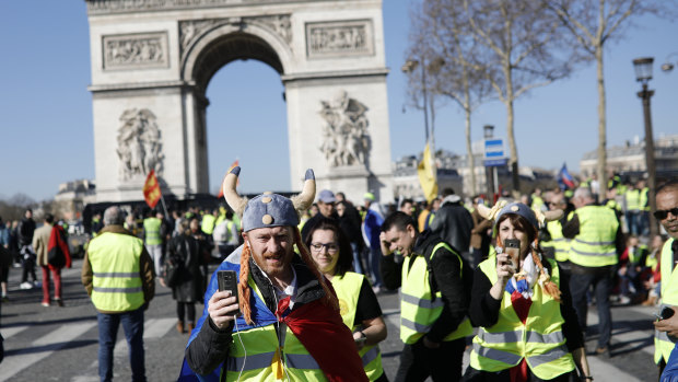 Yellow vest protesters gather at the Arc de Triomphe in Paris, France, on Saturday for the 15th weekend of protest.