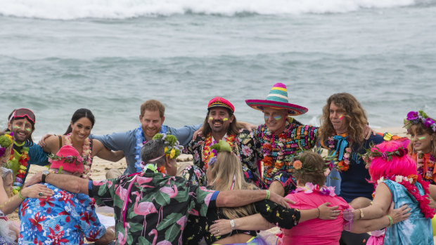 Prince Harry and Meghan, Duchess of Sussex sit on the sand with ‘Anti-bad-vibe circle’ local surfing community group, known as OneWave, raising awareness for mental health and wellbeing in a fun and engaging way at Bondi Beach.