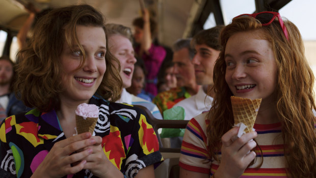 From left: Eleven (Millie Bobbie Brown) and gal pal Max (Sadie Sink) discover it's a material world in Stranger Things, season 3.