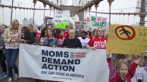 Mothers (and a father) opposing guns walk across the Brooklyn Bridge.