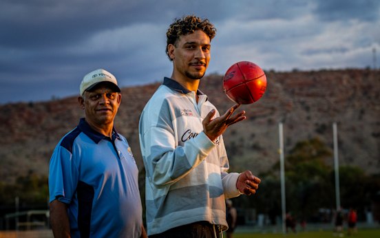 Local footballer from Redtails/Pinktails Right Tracks Foundation Kaleel Ross (right) and father Lachlan Ross.
