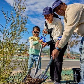 Prithvi Shiva Kumar, his wife Tejasvi Prithvi and four-year-old daughter Aadhya plant their first tree on their new block in East Wannaroo.