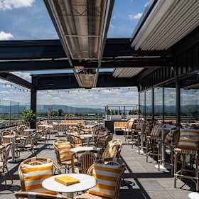 The rooftop has a lighter, brighter colour scheme than downstairs.