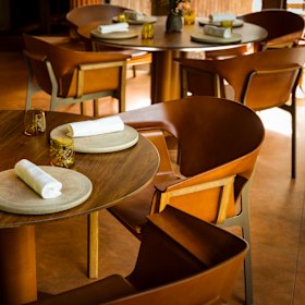 The Tasmanian blackwood, brass and moulded leather chairs at Yiaga, designed by John Goulder.