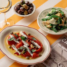 Antipasti including roasted capsicums and artichokes with mozzarella.