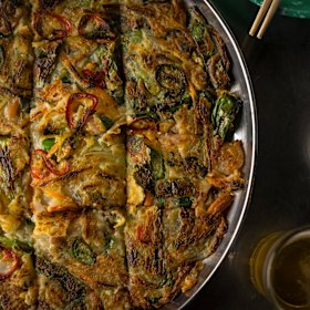 Seafood pancake with ganjang (soy sauce).