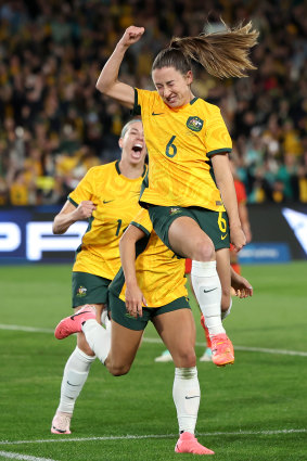 Clare Wheeler celebrates scoring against China in June.