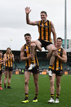 Hawks star Ben McEvoy is chaired from the field after his last game.