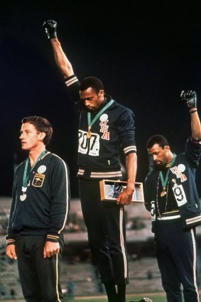 October 16, 1968: Tommie Smith and John Carlos protest against racism in the United States. On the dais with them is Australian silver medallist Peter Norman, who was sidelined for his role in the protest.