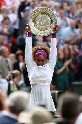 Serena Williams with the 2012 WImbledon trophy.