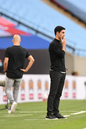 Mikel Arteta watches on as his side beats City.