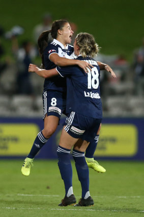 Angela Beard and Kayla Morrison enjoy the moment after the win.