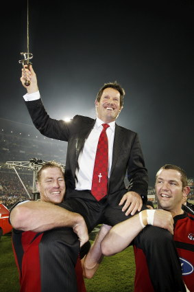 A long time coming: Thorn, left, helps hold aloft Crusaders coach Robbie Deans after their Super 14 final victory over the Waratahs in 2008. 