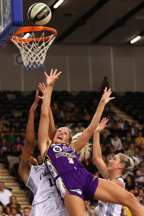 Off balance: Sophie Cunningham gets knocked off course on her way to a lay-up for the Boomers.