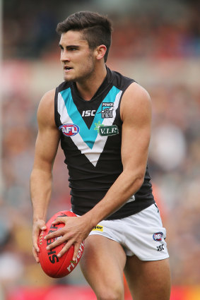 Chad Wingard of the Power runs with the ball during the match against the Crows.
