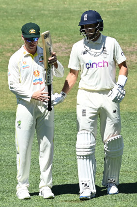 Marcus Harris inspects Joe Root’s bat in Adelaide during the second Test.