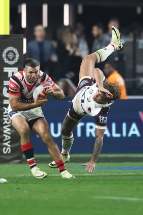 James Tedesco takes a catch under pressure from Reece Walsh.