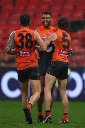 Brown celebrates a goal with his Giants teammates.