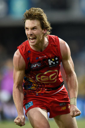 Noah Anderson celebrates his after-the-siren goal to deliver the Suns an historic come-from-behind win over Richmond.