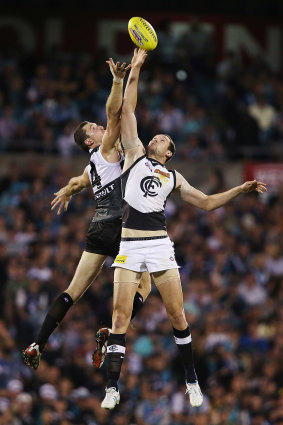 Brent Renouf of the Power competes in the ruck with Robert Warnock of the Blues.