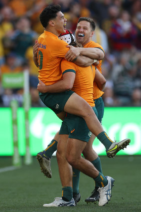  Noah Lolesio celebrates with try-scorer Fraser McReight.