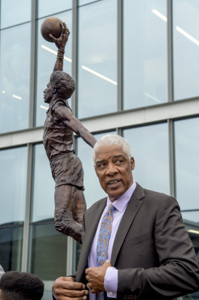Julius 'Dr J' Erving, next to a sculpture of himself outside the 76ers' training complex,  had high praise for Ben Simmons.