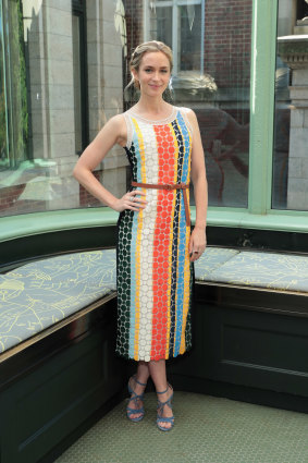 Actor Emily Blunt wearing Tory Burch backstage at a recent show by the label.