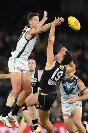 Bryan Teakle of the Power competes in the ruck against Rowan Marshall of the Saints.