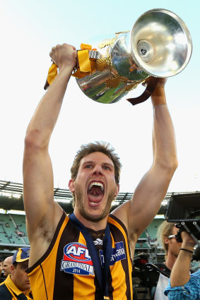 Grant Birchall celebrates the 2014 premiership, one of four flags he played in for Hawthorn.