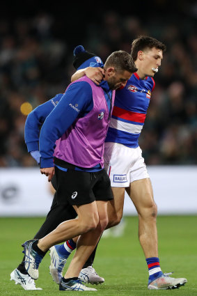 Laitham Vandermeer is helped from the field.